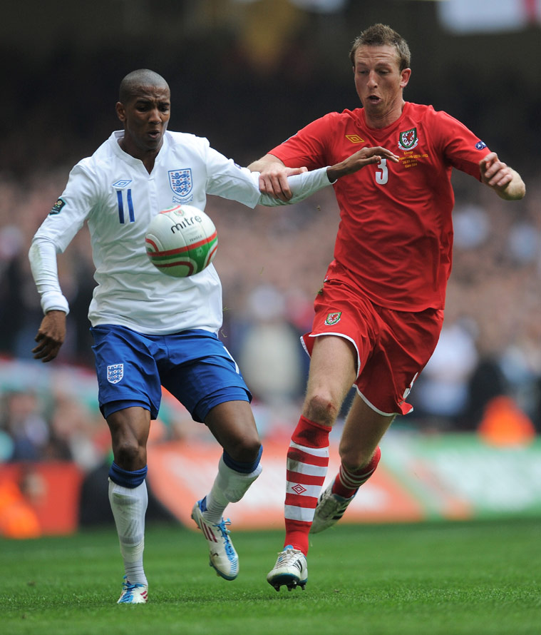Ashley Young comes up against Danny Collins in Cardiff.
